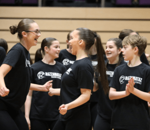 Older students dancing and smiling